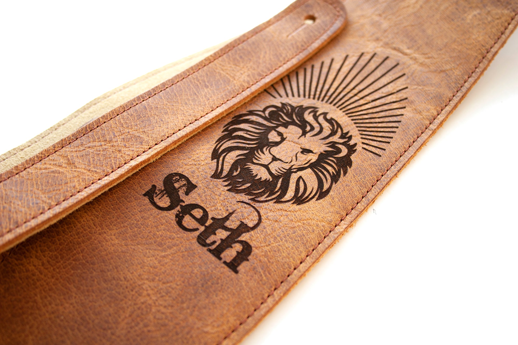 Leather guitar strap with a lion laser engraved. 
