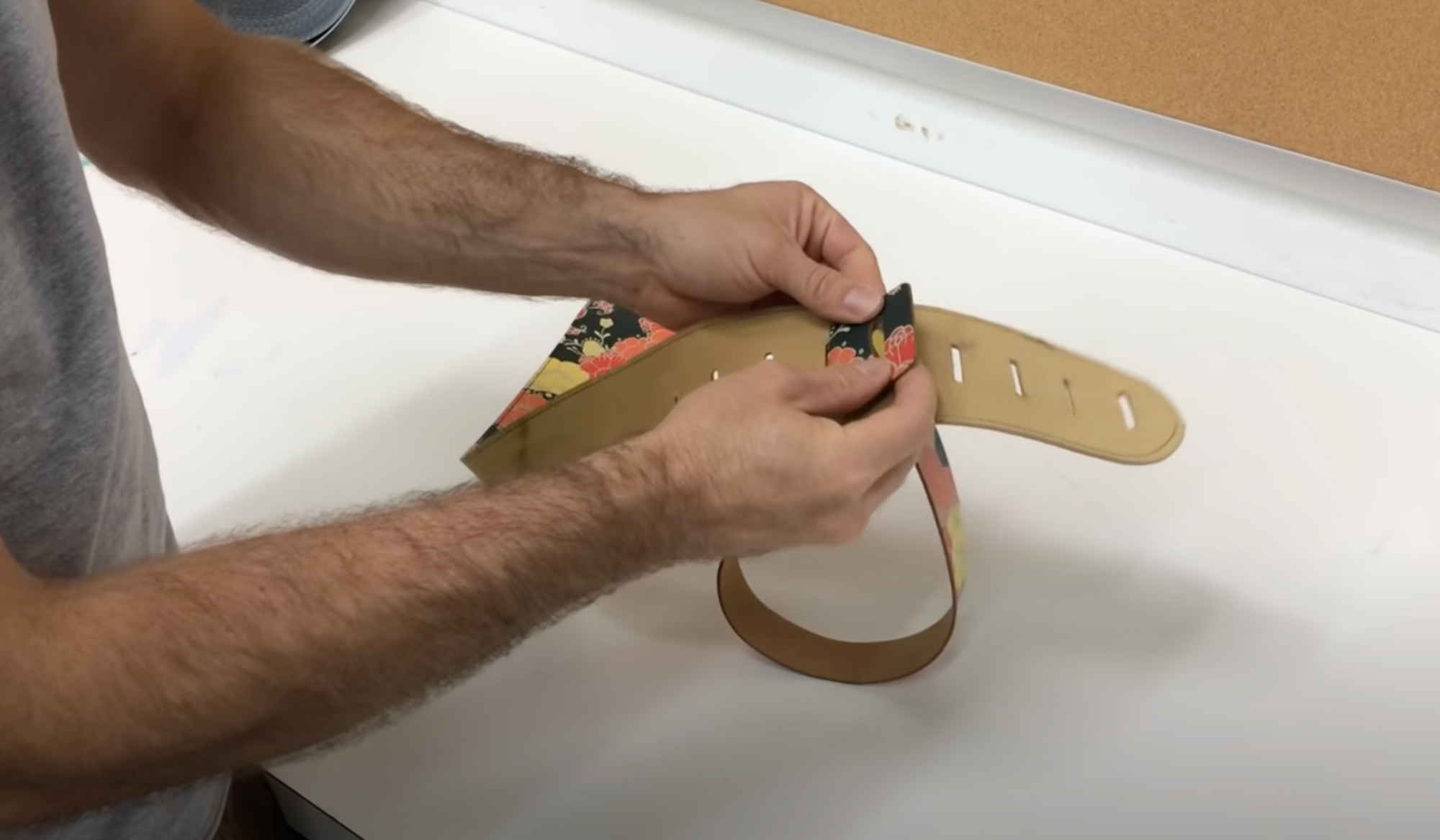 Adjusting a leather guitar strap