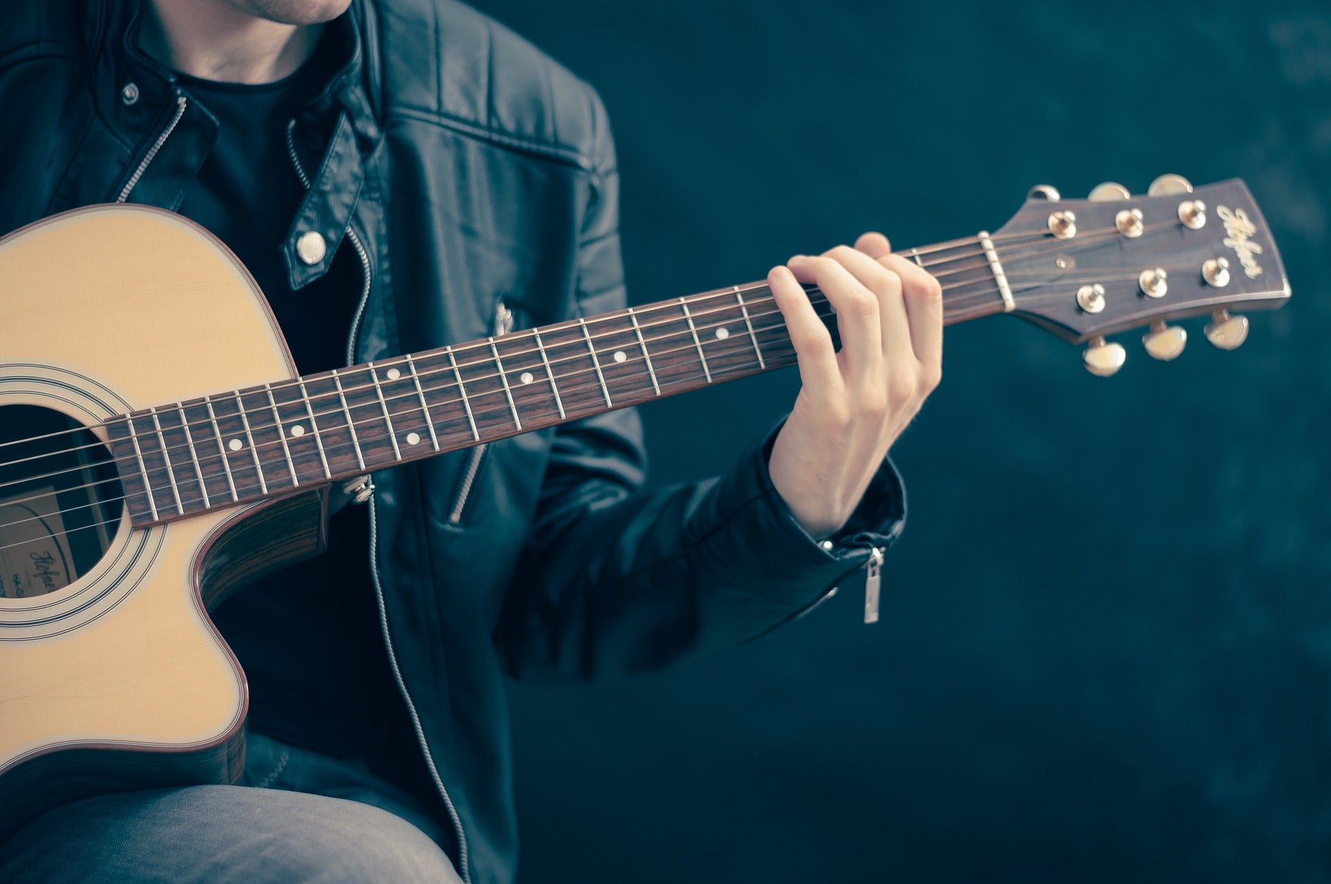 Man playing the guitar. 