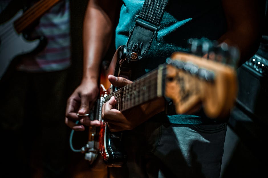 Dude rocking the guitar.