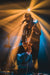 Guitar Player shining on stage. 