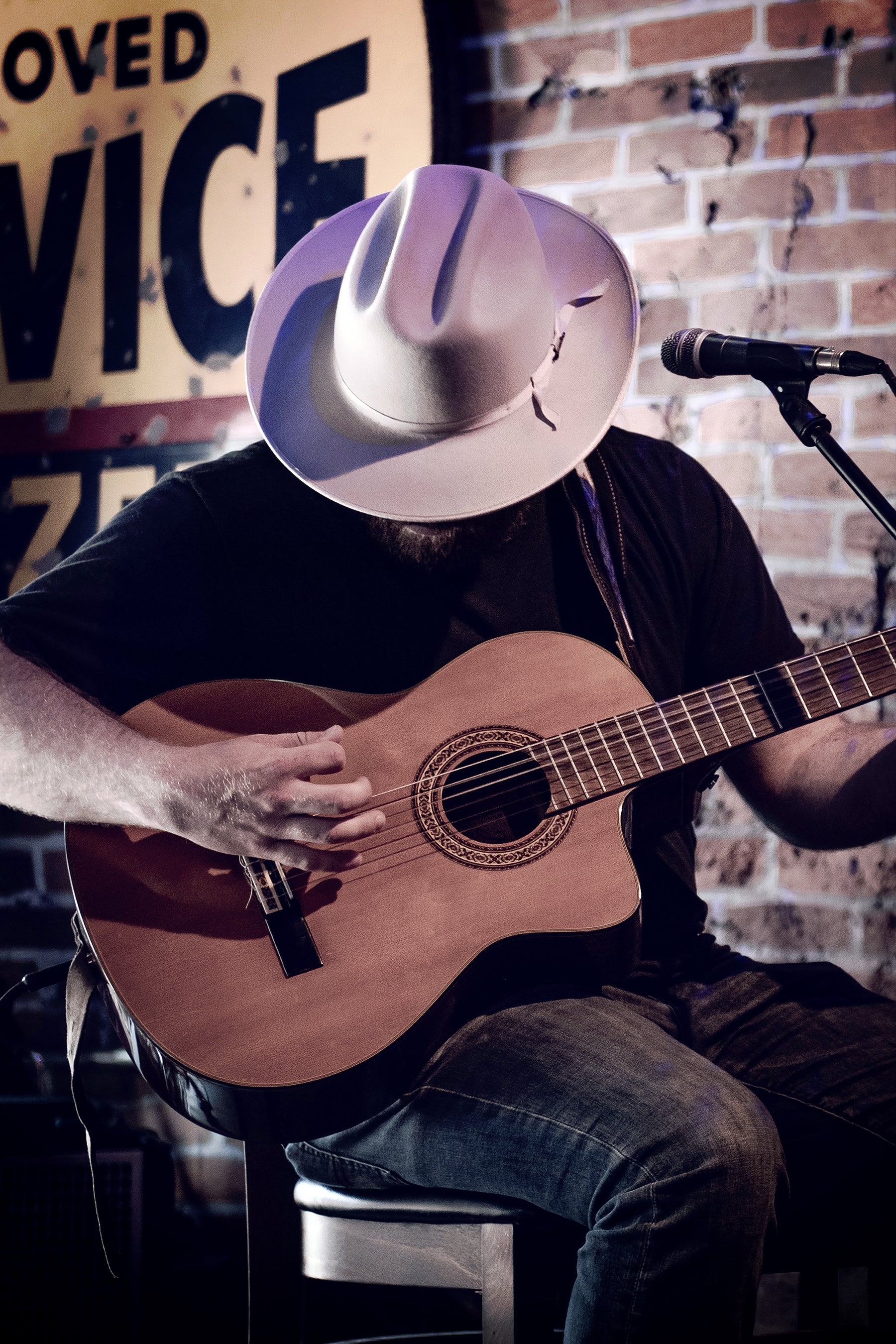 Acoustic Guitar Player with a hat.