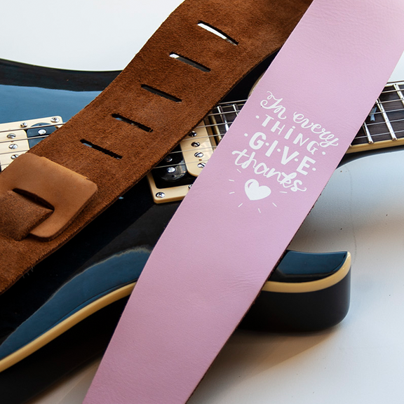 Pink leather guitar strap
