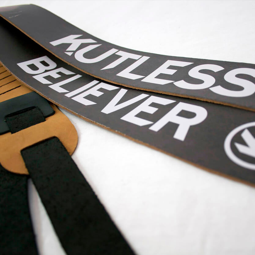 High-quality leather guitar straps with band logos, perfect for merchandise and show merchandise.